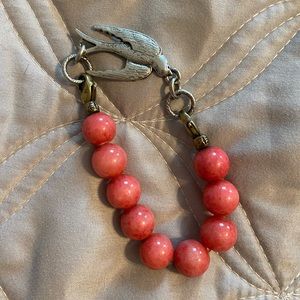 Beaded bracelet with bird charm